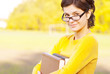 Young student holding books