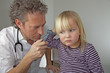 ear specialist examines a girl
