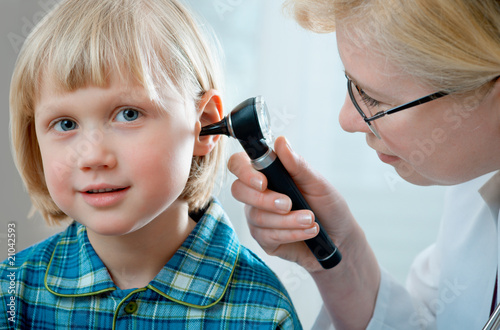 Photo: female doctor examining little child boy female doctor examining little child boy