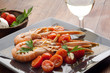 dish with scampi with tomatoes