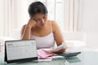 Asian woman stress over bills