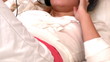 Positive woman listening music lying on a bed at home Positive woman listening music lying on a bed at home