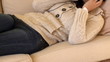 Quiet woman listening music lying on sofa at home Quiet woman listening music lying on sofa at home