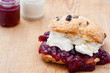 Fresh home baked scone with jam and clotted cream