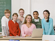 Teacher posing with students