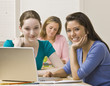 Students using laptops in classroom