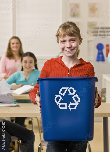 Photo: Girl holding recycling bin Girl holding recycling bin