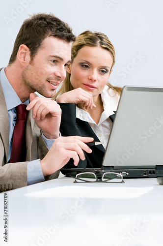 Photo: Working together on laptop Working together on laptop
