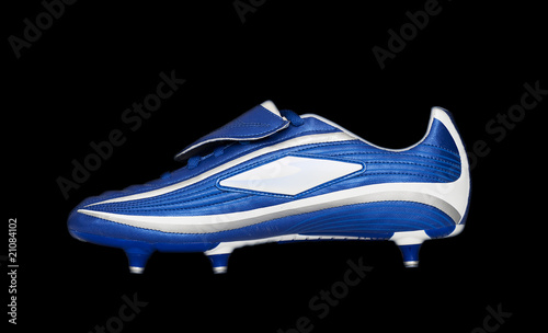 Photo: Football boot on black background Football boot on black background