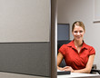 Photo : Businesswoman sitting at desk smiling Businesswoman sitting at desk smiling