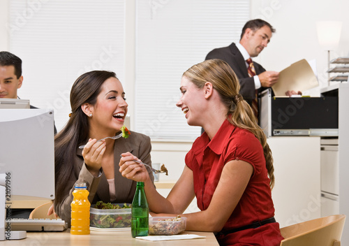 Photo: Businesswomen eating salad for lunch Businesswomen eating salad for lunch
