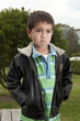 portrait of little Pacific Islander boy making pouty face