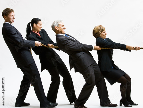 Photo: Business people playing tug-of-war Business people playing tug-of-war