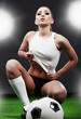 Sexy soccer player, woman on playing field