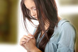 Young caucasian woman praying