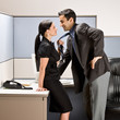 Photo: Co-workers kissing in office cubicle Co-workers kissing in office cubicle