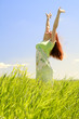Beautiful woman in green field