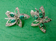 Golden jewelry with emerald and brilliants Golden jewelry with emerald and brilliants