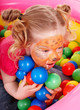 Little girl with group ball. Make up.