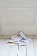 Letters on floorboards at front door