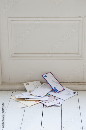 Photo: Letters on floorboards at front door Letters on floorboards at front door