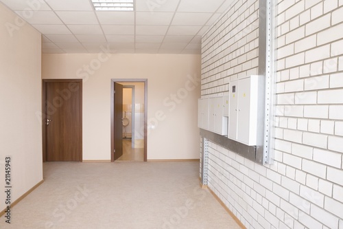 Photo: Tiled wall with fusebox in wide hallway Tiled wall with fusebox in wide hallway