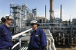 oil workers and power plant