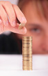 Young woman counting her savings Young woman counting her savings