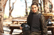 Young woman getting ready for paintball