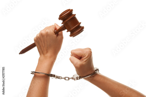 Photo: Handcuffed Woman Holding Wooden Gavel on White Handcuffed Woman Holding Wooden Gavel on White