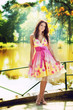 Sexy woman outdoor with colorful dress