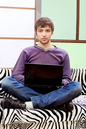 Photo: boy with his laptop boy with his laptop