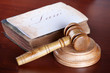 Judges gavel with very old book