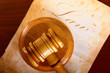 Judges gavel with very old paper