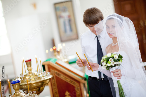Photo: bride and groom in the church bride and groom in the church