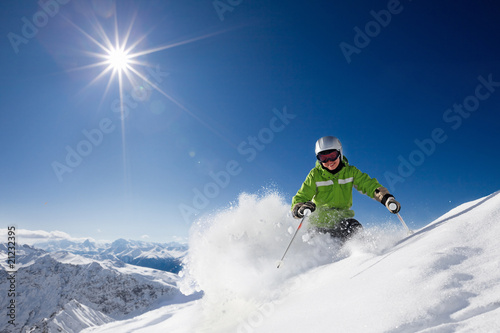 Photo: Happy female skier with mountain view Happy female skier with mountain view