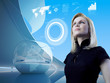 Photo: Attractive blonde with interface in future interior Attractive blonde with interface in future interior