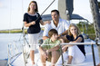 Photo: Family with teenagers relaxing together on boat Family with teenagers relaxing together on boat