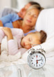 Foto: Young family sleeping together on the bed Young family sleeping together on the bed