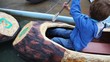 boy and girl row in small boats on water in park attraction