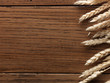 Wheat spikes on wooden board
