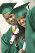 Graduates Holding Diplomas