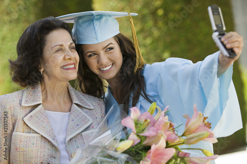 Photo: Graduate and Grandmother Taking Picture with Cell Phone Graduate and Grandmother Taking Picture with Cell Phone