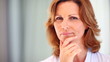 Attractive mature woman thinking very deeply