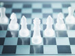 Glass chess pieces on glass chess board