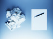 Crumpled paper balls with notepad and fountain pen