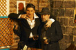 2 retro gangsters posing
