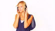 Pretty woman listening to music with headphones