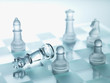 Glass chess pieces on glass chess board