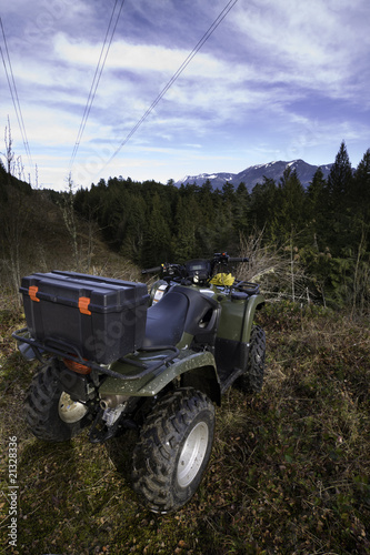 Photo: Parked ATV at mountain top vista Parked ATV at mountain top vista